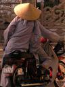 A pair of monks on a scooter.